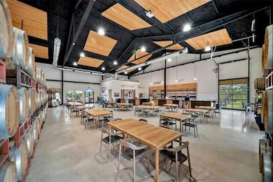 Dining area featuring a towering ceiling and conc