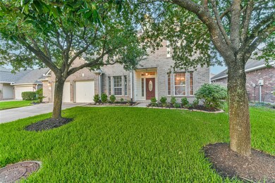 Mature trees in the front yard add shade.