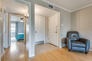 Sitting room with ceiling fan, light hardwood / wood-style floors, and crown molding