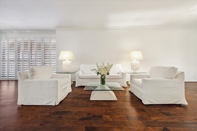 Bright and airy living room with wood floors, and