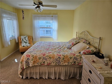 Bedroom with carpet floors and a ceiling fan