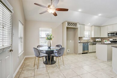 Breakfast room has a view of the backyard and pool.