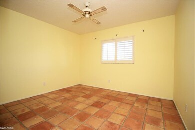 Unfurnished room featuring ceiling fan and baseboards