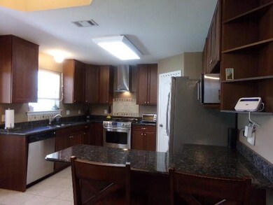 Kitchen has SS Appliances and Granite