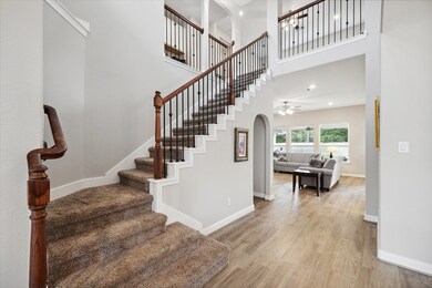 Step inside to discover a grand entrance, a staircase flanked with wrought iron spindles & freshly painted downstairs interior in neutral color shades.