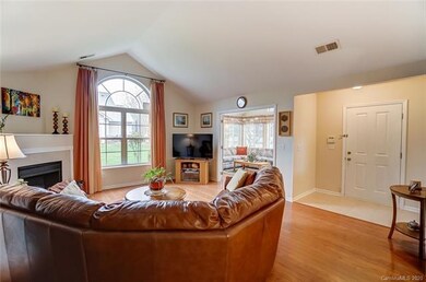 Vaulted great room with gas fireplace open to dini