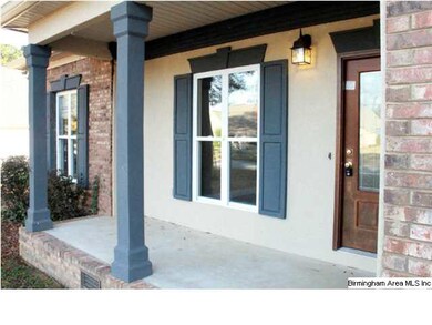 Well maintained stucco accents surround the doorwa