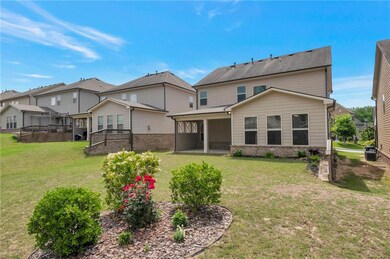 Rear view of property with a yard, brick siding, c