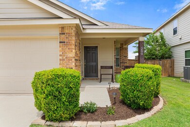 Property entrance with brick siding, an attached 