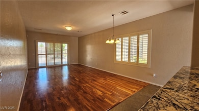 Unfurnished dining area featuring a chandelier, vi
