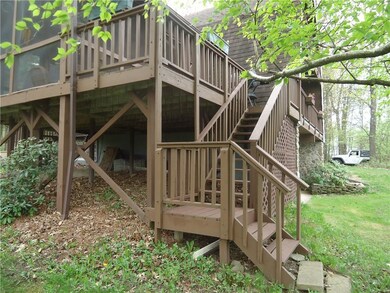 Stair entry to the fully screened porch