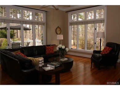 Floor to ceiling windows in family room - golf cou