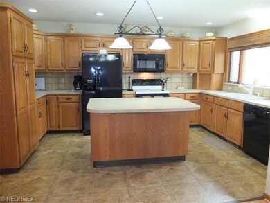 Tons of cabinet space in this kitchen with a pantr
