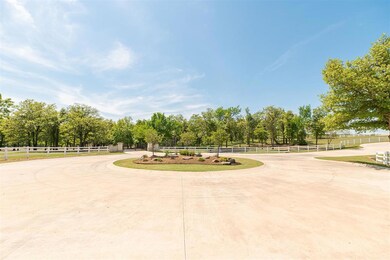 View of community featuring fence and curved driveway