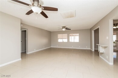 Unfurnished room with ceiling fan, baseboards, and
