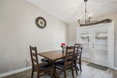Dining area with double glass doors leading to the