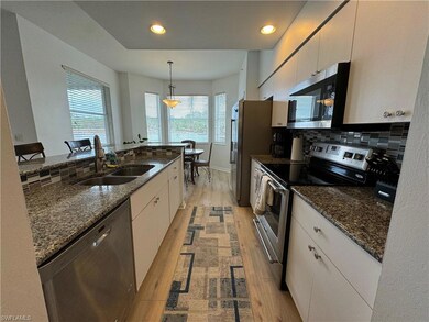 Kitchen featuring stainless steel appliances, a he