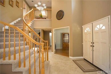 Entry area with view of bonus room and hallway to 