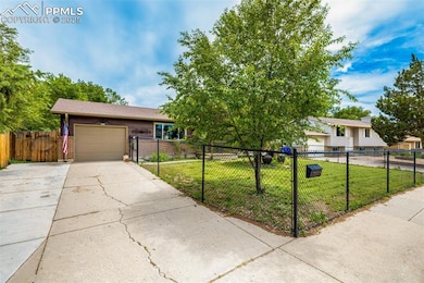 View of front facade featuring concrete driveway, a garage, and brick siding