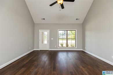 Features Soaring Ceilings and Hardwoods