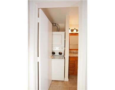 Bathroom. A stackable full size Washer/Dryer is co