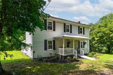 View of front facade featuring covered porch and a