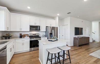High-end gourmet kitchen with premium finishes and upgraded appliances *Model representation
