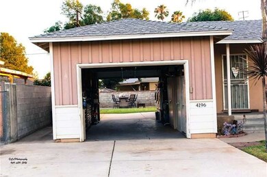 Pull through garage with access to large backyard.