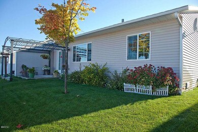 Back yard with trellis and patio area