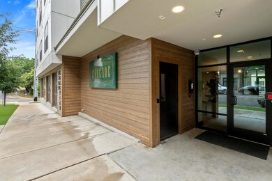 Doorway to property with elevator and a patio area
