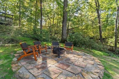 View of patio featuring a fire pit