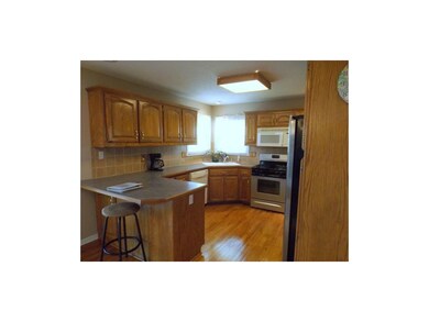 Corner sink with windows on both sides provides go