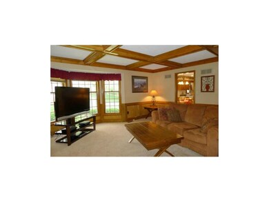 Bay window, beamed ceiling, library paneling highl