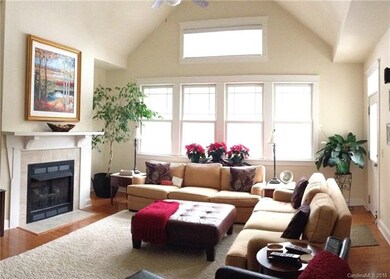 Vaulted family room with fireplace and tons of nat