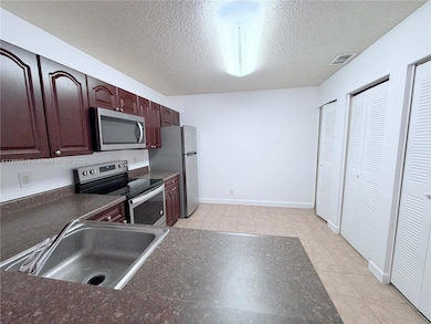 5761 Riverside Dr unit 303B4, Coral Springs, FL 33067 - photo 2