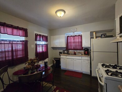 Kitchen featuring a sink, gas range gas stove, dar