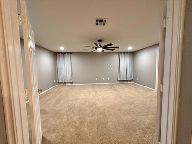 Spare room with a ceiling fan, recessed lighting,