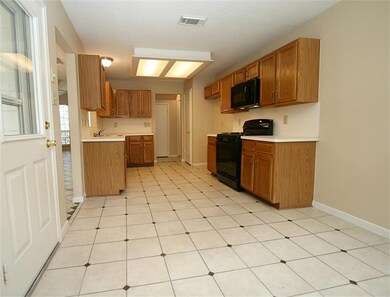 Tile floors with lots of cabinet and counter space in Kitchen