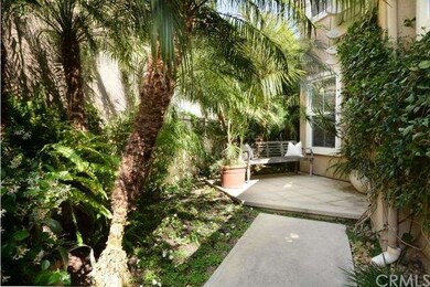 Lush, welcoming private courtyard entry.