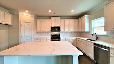 Kitchen featuring stainless steel appliances, a ki