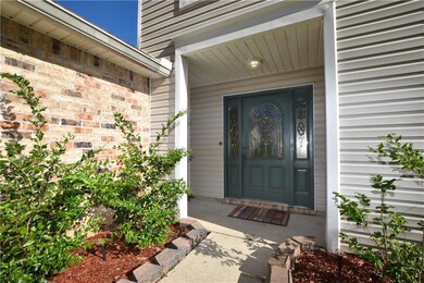 COVERED ENTRY WITH LEADED GLASS FRONT DOOR