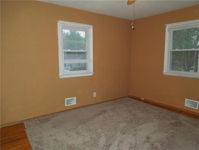 Master bedroom with wood floors.