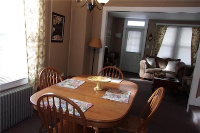 Dining room looking into living room (front door)