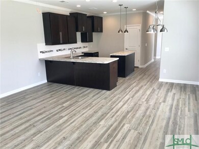 Photo taken 6.22.18. 9' ceilings w/ crown molding.