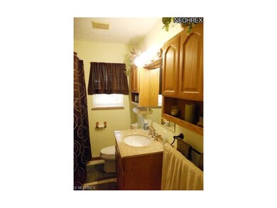 Newer bathroom with granite counter top and lots o