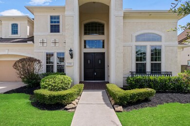 Elegant covered entry with soaring ceilings, lusci