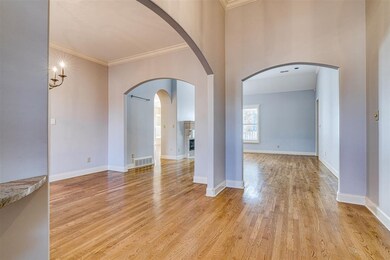 Double door Foyer opens to gleaming hardwood Foyer