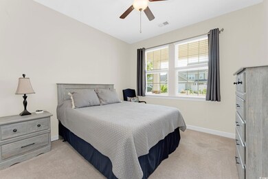Furnished bedroom with ceiling fan