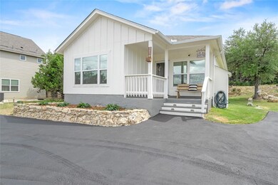 View of front facade with a porch and board and b