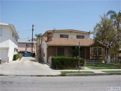 Long driveway with partial view of its neighbor.